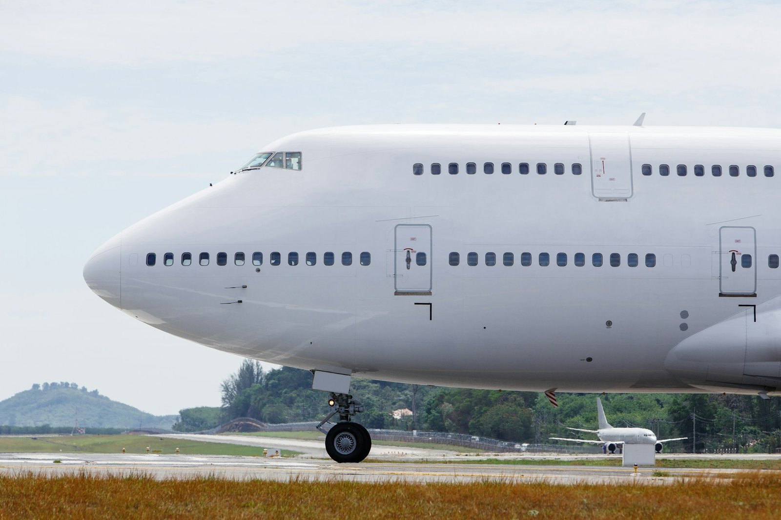 Modern passenger double-decker airplane taxiing to take off. Wide-body aircraft on runway